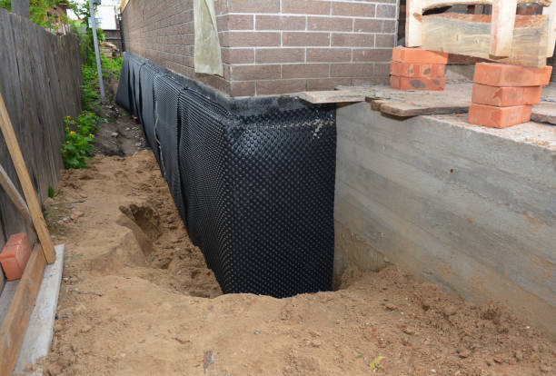 SJ Waterproofing Pros technician performing targeted Interior Drainage System assessment in Knoxville, IL